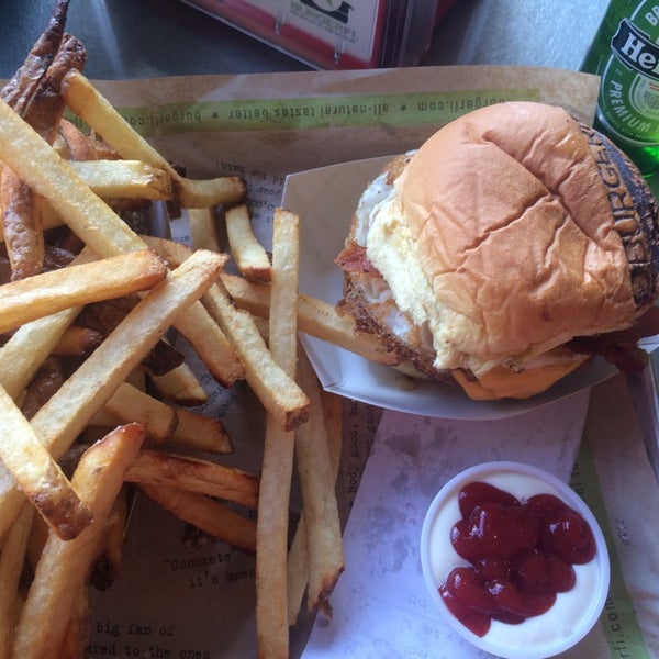 Photo taken at BurgerFi by Nathan J. on 8/31/2014