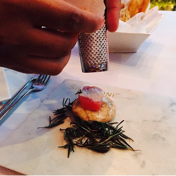 A delicious amuse-bouche to start your dinner with: raw tuna on a hot stone, altogether with rosemary.