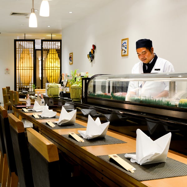 Behind Utage's sushi counter, Chef Samart's smile can always be found.
