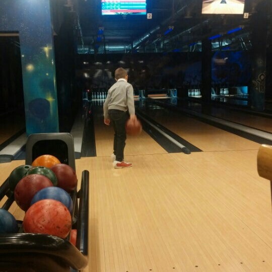 Photo taken at КосмоДоМ bowling &amp; bar by Evgenii P. on 12/6/2015
