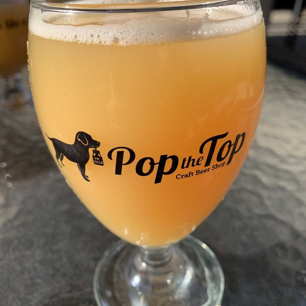 Photo taken at Pop the Top Craft Beer Shop by Rich W. on 2/12/2022