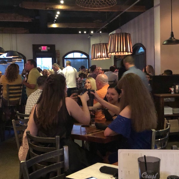 Photo taken at Crust Pasta &amp; Pizzeria by Brian C. on 9/28/2019