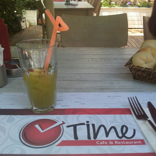 Photo taken at Time Café &amp; Restaurant by Burcu K. on 6/23/2012