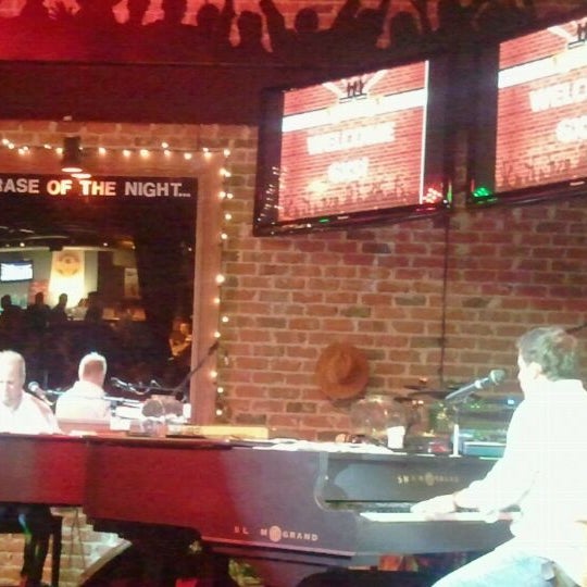 Photo taken at Bobby McKey&#39;s Dueling Piano Bar by Patty on 2/11/2012