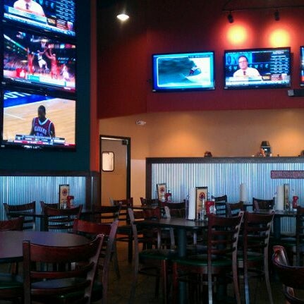 Photo taken at Wings &amp; Rings by A A. on 3/9/2012