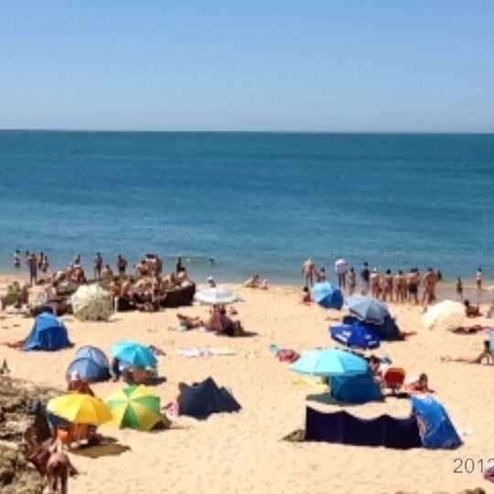 Photo taken at Praia dos Gémeos by Alexandra on 7/15/2012