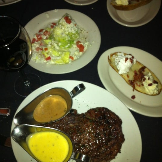 Photo taken at Sullivan&#39;s Steak House by Angel I. on 4/4/2012