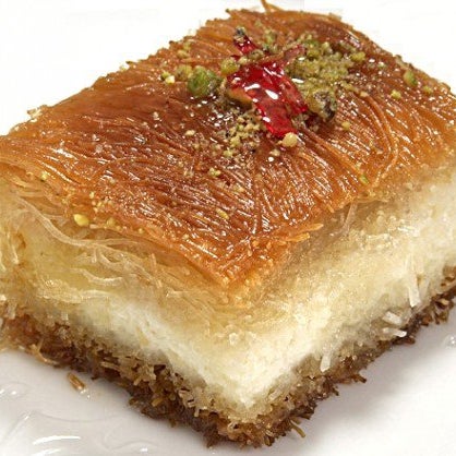 Sweeten up your day with this sugary cheese pastry smothered in orange blossom syrup. Cheese, sugar and butter are best friends in the Kanafeh.