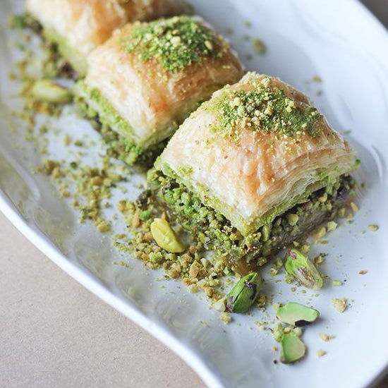 Home Made sweet layers of pastry of filo filled with chopped nuts and topped with pistachio held together with honey. It's ready to serve #baklava