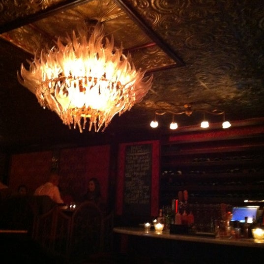 Photo taken at The Bourgeois Pig by Adele M. on 10/16/2012