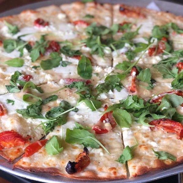 Love their Fire-roasted Caprese Pizza!  All their pizzas are thin crust and is soo good.