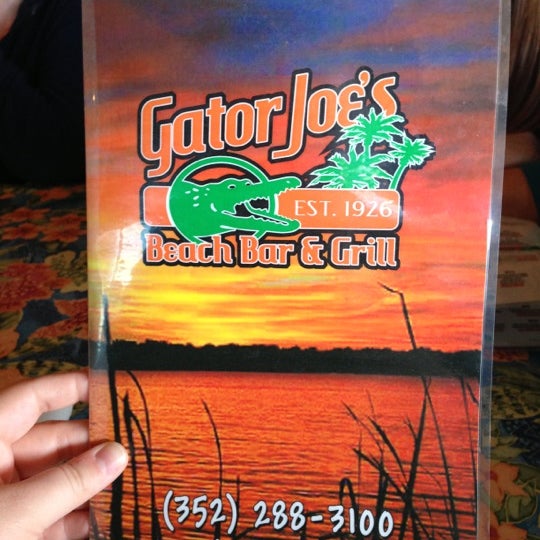Photo taken at Gator Joe&#39;s Beach Bar &amp; Grill by Leslie M. on 2/19/2013