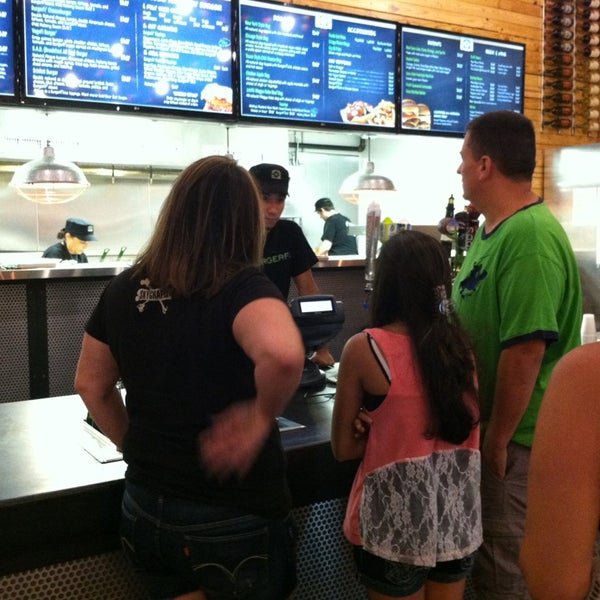Photo taken at BurgerFi by Cole M. on 8/15/2013