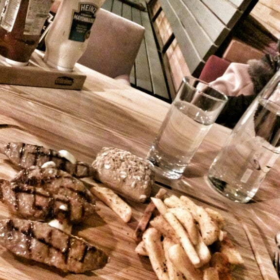 Photo taken at Ora&#39; Steak &amp; Burgers by Erva S. on 12/26/2014
