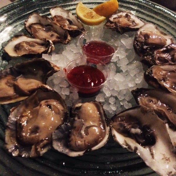 Photo taken at The Grilled Oyster Company by Hoang B. on 5/11/2014