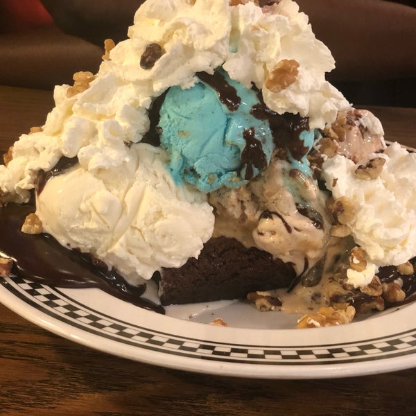 The Brownie sundae w/ hot fudge and your choice of 3 scoops of ice cream was excellent! The brownie is warmed up and smothered in whip cream and a cherry on top. Definitely takes more than 1 to finish