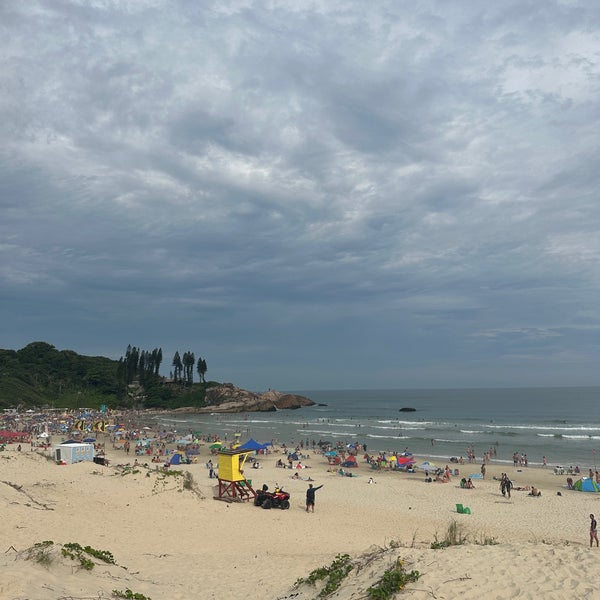 Photo taken at Praia da Joaquina by Renata C. on 1/22/2023