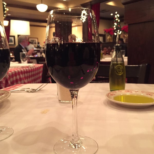 Photo taken at Maggiano&#39;s Little Italy by Ivonne G. on 12/12/2014