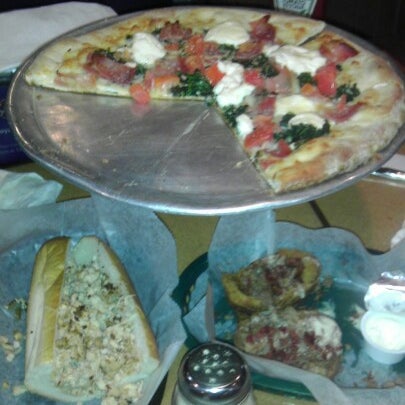 Photo taken at Tonelli&#39;s Pizza Pub by Christopher M. on 12/27/2012