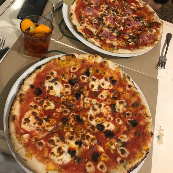 Negroni and Napoli pizza was delicious! Large is LARGE, we could have easily shared one between two. Still ate all of it as it was thin crispy and well made. Go enjoy! Efficient and polite service