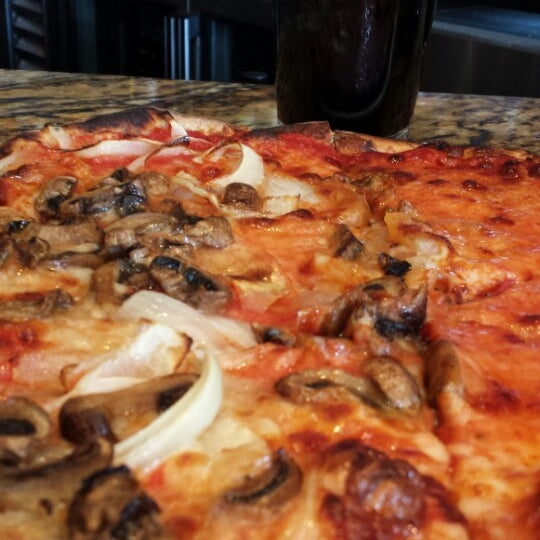 Photo taken at Rizzuto&#39;s Wood-Fired Kitchen &amp; Bar by Fairfield A. on 10/26/2013