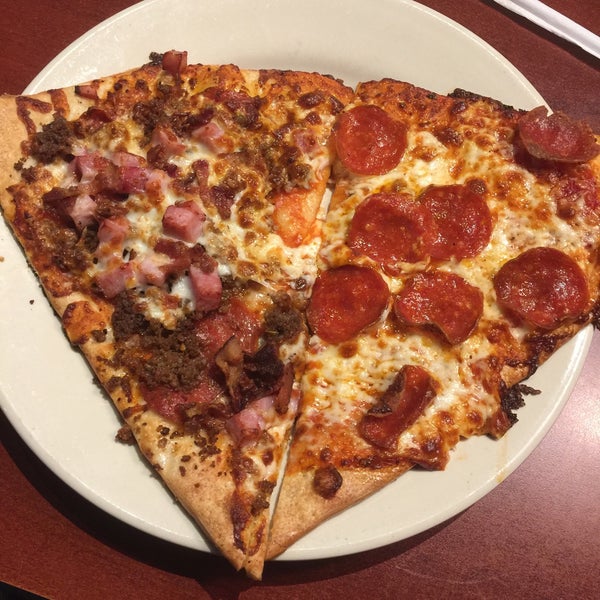 I love that we get to order by the slice... so good! Carnivore & pepperoni are delicious! Great service too! 🍕