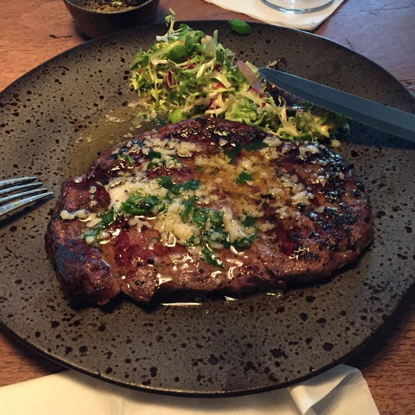 Amazing ribeye steak with roasted garlic and herb butter. Highly recommended.