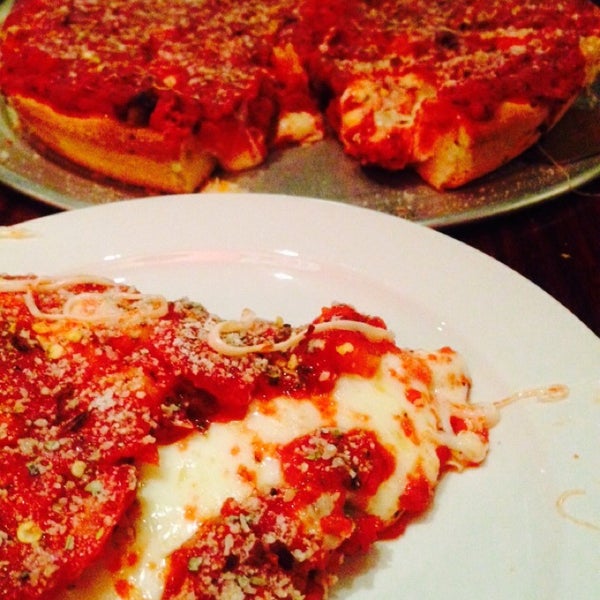 Photo taken at Kylie&#39;s Chicago Pizza by Peter A. on 12/21/2014