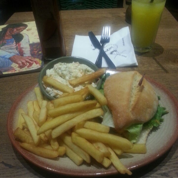 Photo taken at Nando&#39;s by Adrian L. on 4/30/2014