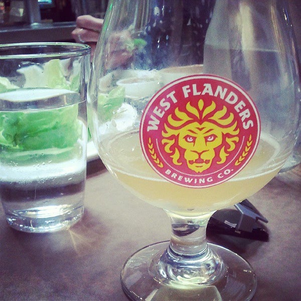 Photo taken at West Flanders Brewing Company by Lauren H. on 7/19/2013