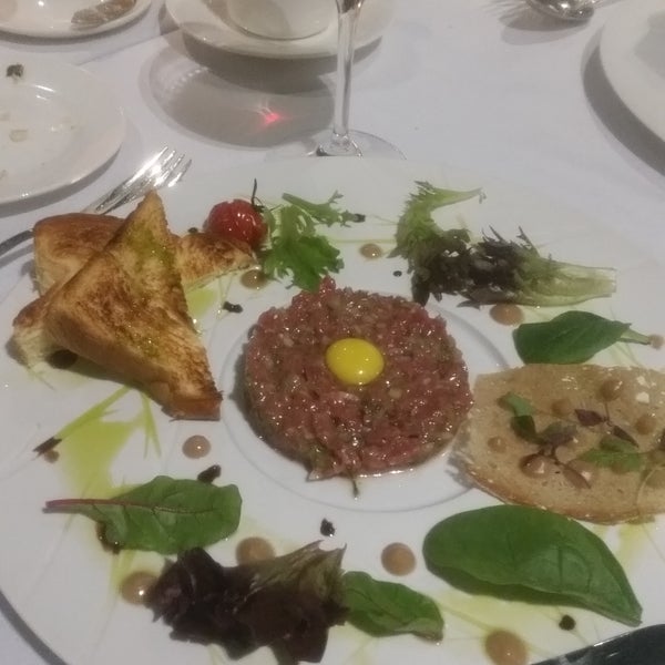 Beef tartar is good. Well prepared and lots of flavor. Service is good. Wines are expensive. Says it's Italian restaurant but it's actually French. A little pricey but worth it.