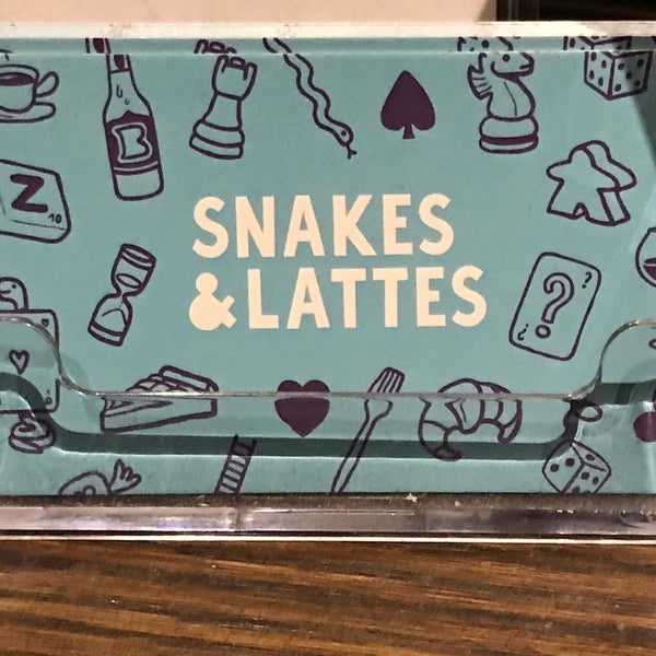 Photo taken at Snakes &amp; Lattes by Carlos G. on 3/31/2018