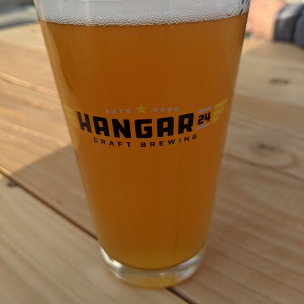 Photo taken at Hangar 24 Craft Brewery by Dennis on 3/23/2021