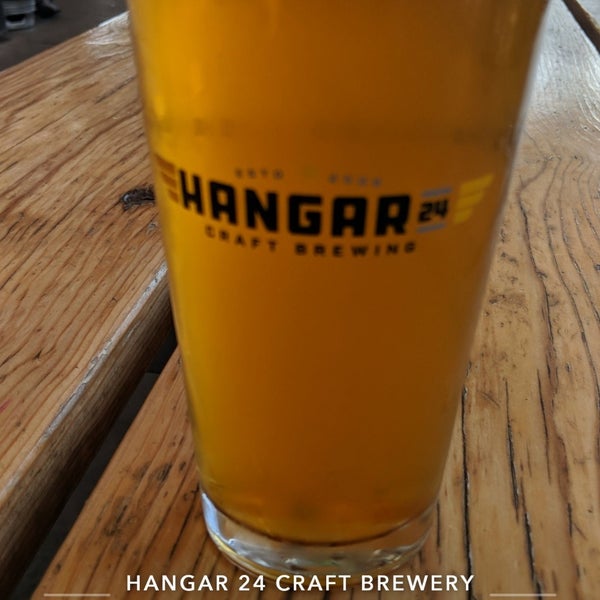 Photo taken at Hangar 24 Craft Brewery by Dennis on 6/12/2019