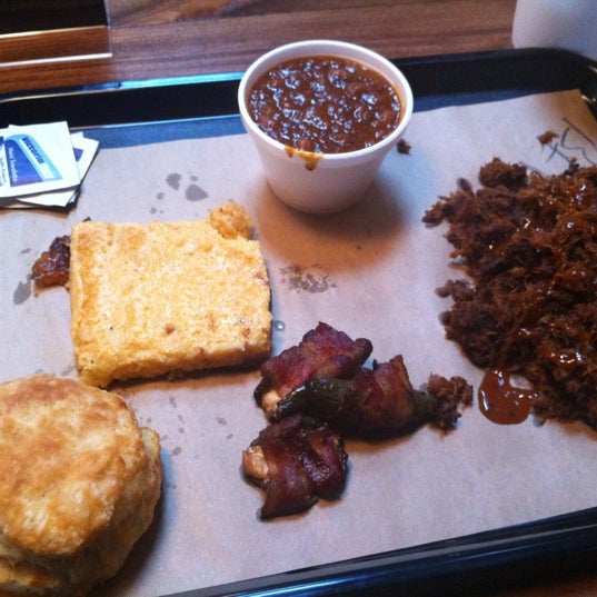 Photo taken at 4 Rivers Smokehouse by Christie R. on 6/13/2013