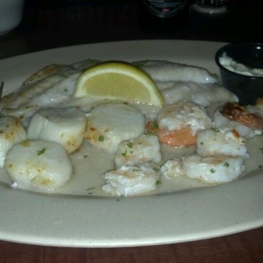 Photo taken at Oyster Bay Seafood Cafe by Joni F. on 6/2/2012