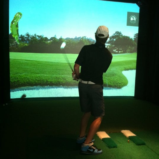 Photo taken at The Range Golf Center &amp; Sports Bar by Jody G. on 8/4/2012