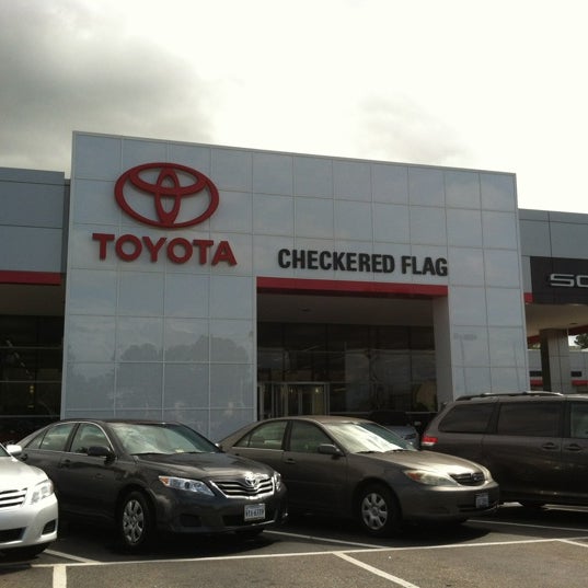 Photo taken at Checkered Flag Toyota by Paul H. on 6/5/2012