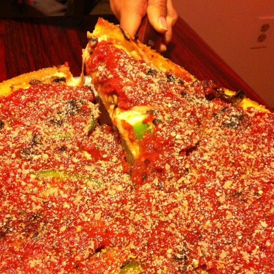 Photo taken at Kylie&#39;s Chicago Pizza by Juney H. on 9/17/2011