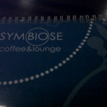 Photo taken at Symbiose Coffee&amp;Lounge by Miguel K. on 12/24/2011