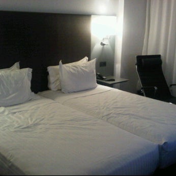 Photo taken at AC Hotel Porto by Ricardo F. on 7/22/2011