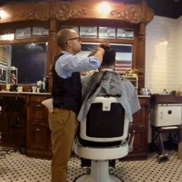 Photo taken at Neighborhood Cut and Shave Barber Shop by Vince C. on 8/20/2012