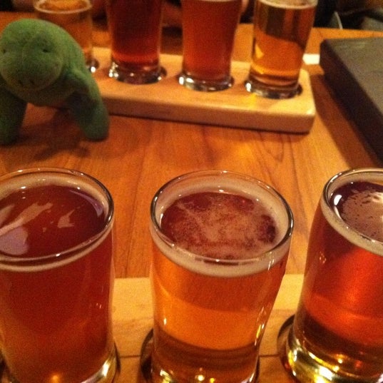 Photo taken at The Noble Pig Brewhouse &amp; Restaurant by Carey E. on 12/22/2011