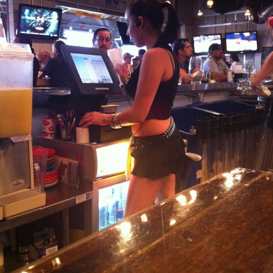 Photo taken at Ojos Locos Sports Cantina by Tom C. on 3/14/2012