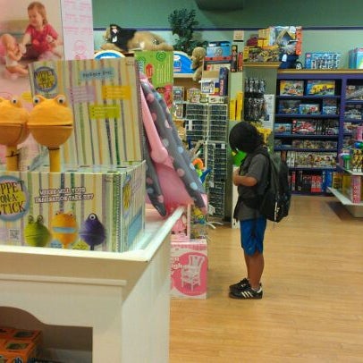 Photo taken at Cheeky Monkey Toys by Anson M. on 5/2/2012