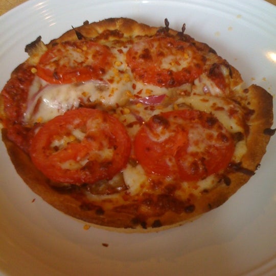 Photo taken at Classic Chicago&#39;s Gourmet Pizza by Barry Y. on 3/21/2011