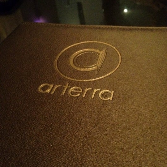 Photo taken at Arterra Restaurant and Lounge by Augusto D. on 11/21/2011