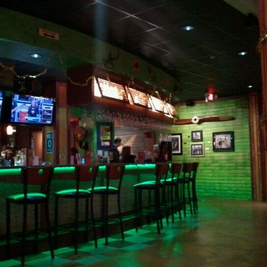 Photo taken at Jimmy&#39;s Island Grill &amp; Iguana Bar by Curtis W. on 12/10/2011