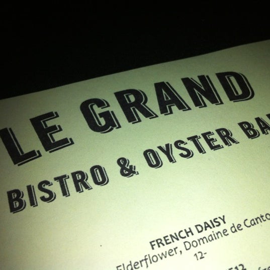 Photo taken at Le Grand Bistro &amp; Oyster Bar by Sherri M. on 3/4/2012