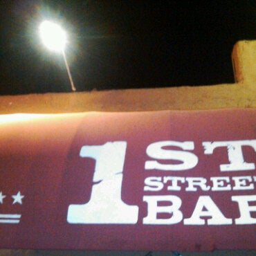 Photo taken at 1st Street Bar by Patrick K. on 2/27/2011